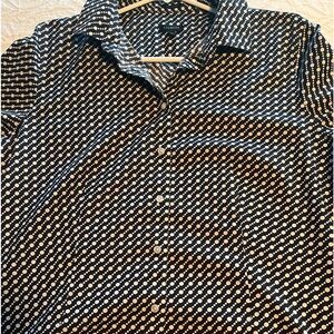 A Talbots Wrinkle Resistant Navy and White Polka Dot Blouse.